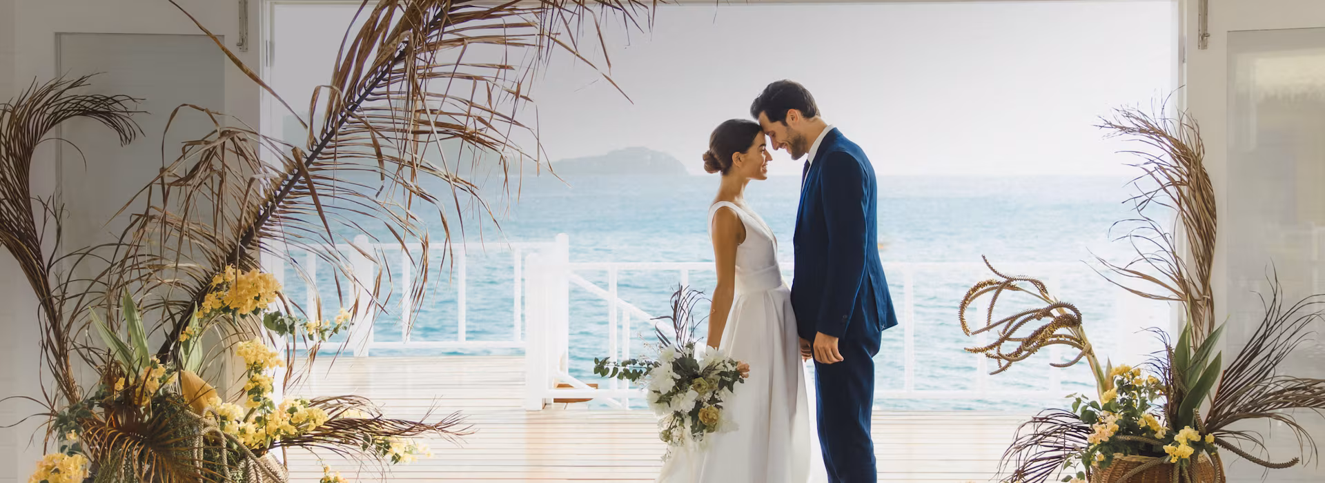 Couple just married at Sandals Jamaica resort celebrating on the beach