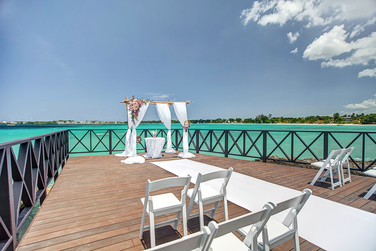 Jamaica morning wedding ceremony on a pier with turquoise Caribbean waters