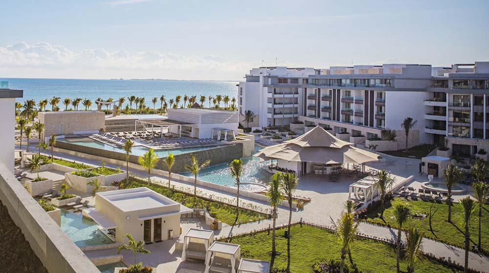 Majestic Elegance Costa Mujeres in Punta Cana showing hotel, palms trees, pools, and beach