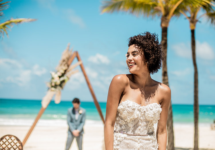 Bride and groom celebrate destination wedding on Punta Cana beach, popular choice for Canadian couples